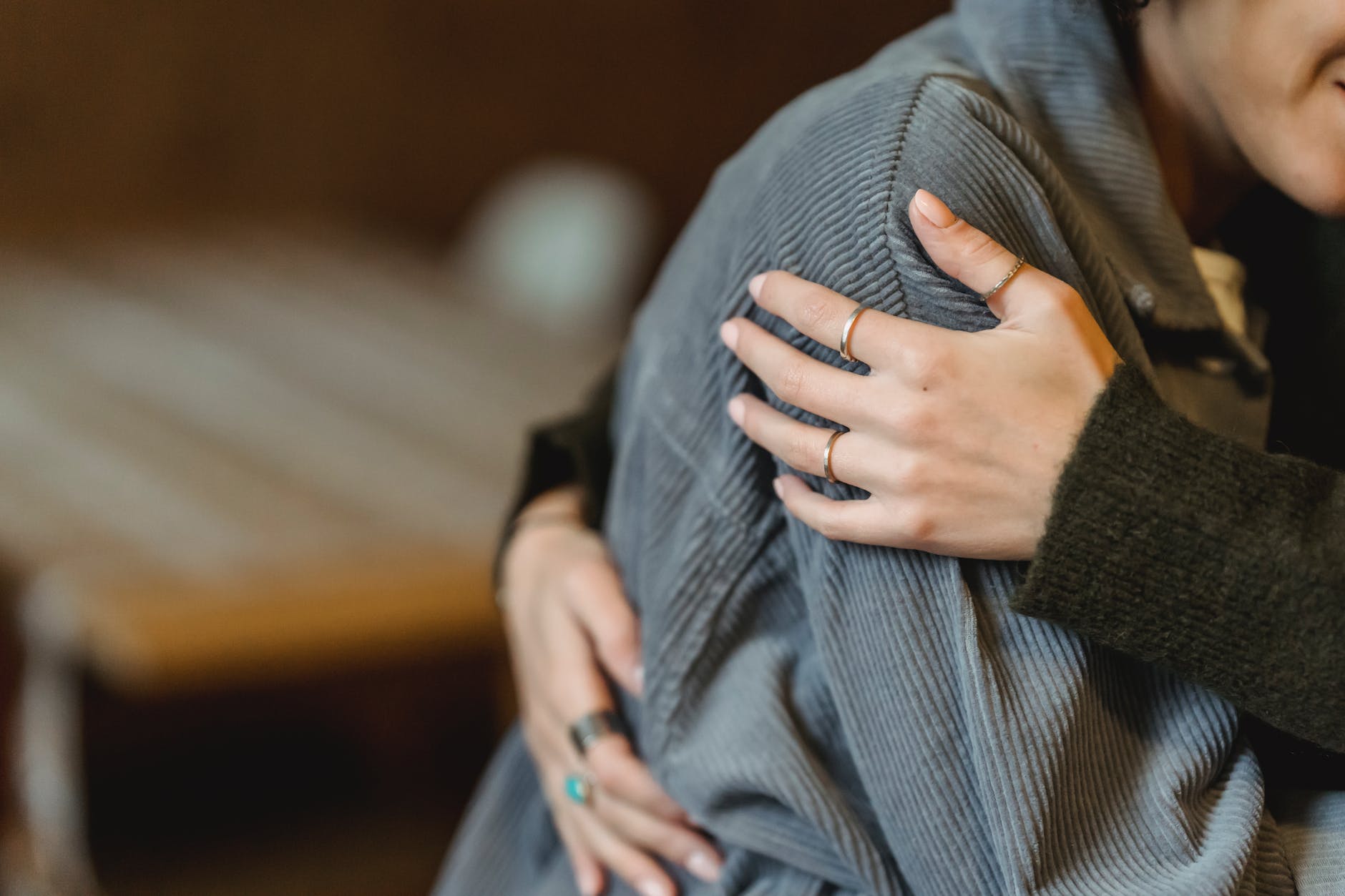 woman comforting desperate girlfriend and embracing gently