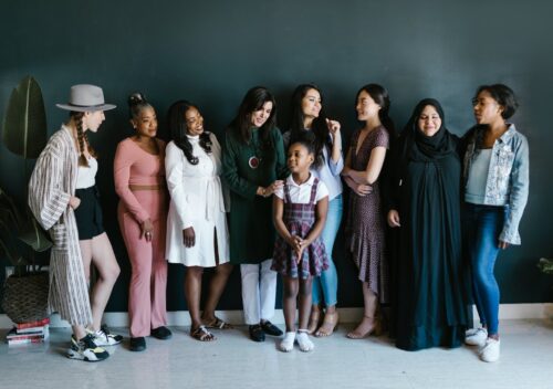 group of women standing close to each other